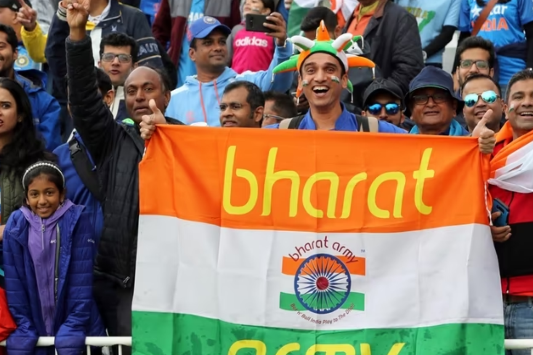 A man holds a Bharat flag in public